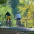 couple bicycling down path in Boise green belt